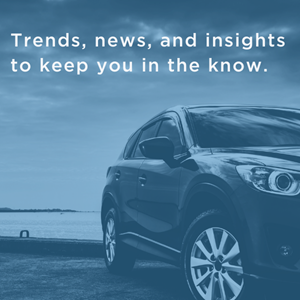 A car is parked in front of a body of water. The caption reads: "Trends, news, and insights to keep you in the know."
