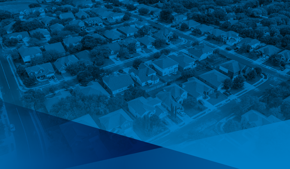 Birds eye view of streets of similar styled houses in rows side-by-side.